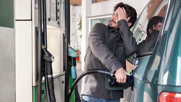 Man frustrated by the high gas prices.