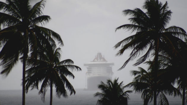 Cruise ship in misty rainy seas.