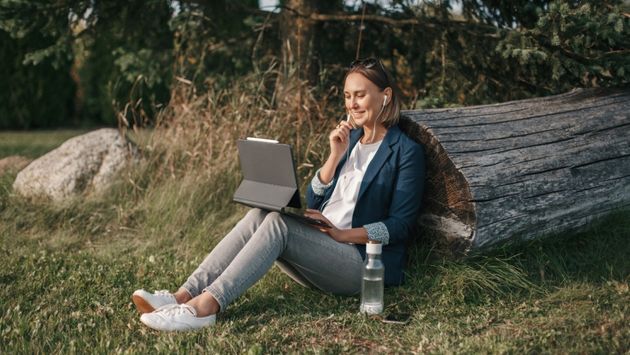 A woman works remotely outside in Chile.