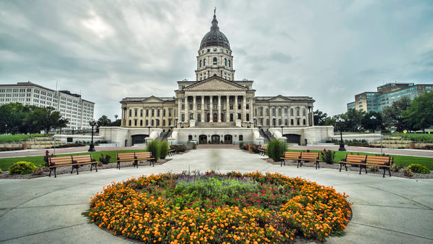 The Kansas state capitol building is located in downtown Topeka on land donated by the Atchison, Topeka and Santa Fe Railroad company. Construction began in 1866 and was officially completed 37 years later in 1903 at a total cost of just over 3.2 million