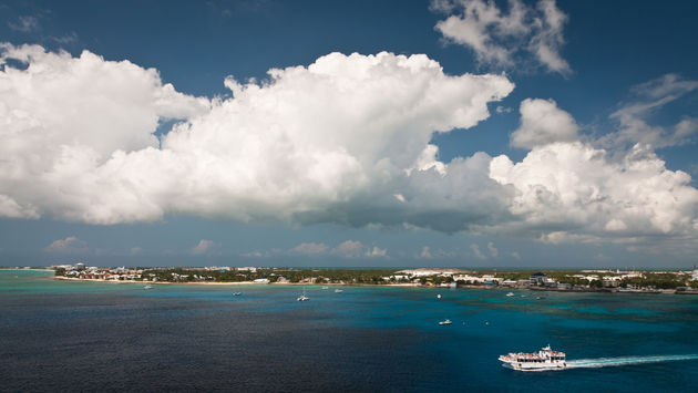 Aerial view of a coastline of Grand Cayman, Cayman Islands (photo via unclegene/iStock/Getty Images Plus)