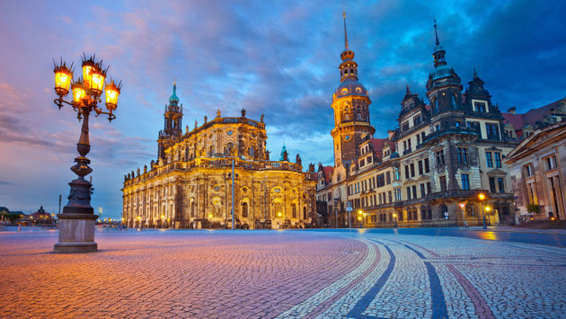 Image of Dresden, Germany during twilight blue hour. (photo via RudyBalasko / iStock / Getty Images Plus)