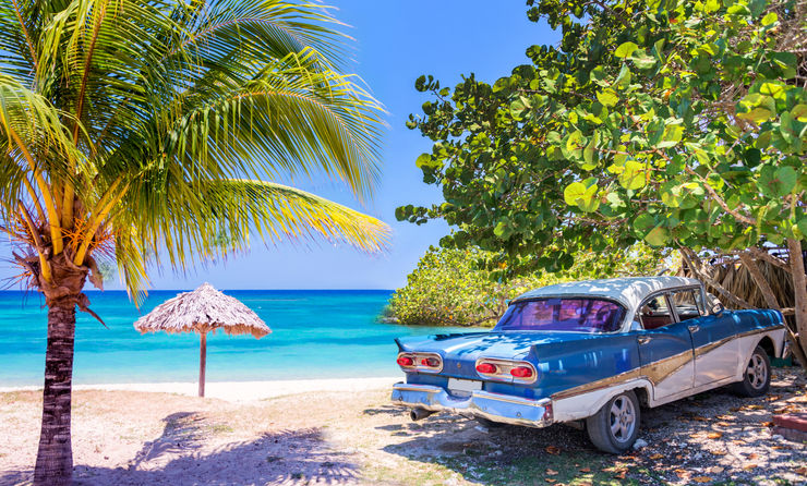Vintage american oldtimer car parked on a beach in Cuba (Photo via Delpixart / iStock / Getty Images Plus)